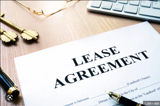 A legal document with the text of a lease agreement written in black ink on white paper.